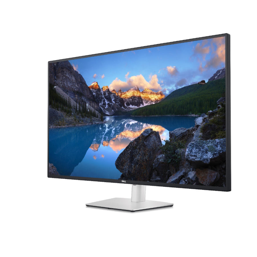Computer monitor displaying a mountainous landscape on a white background