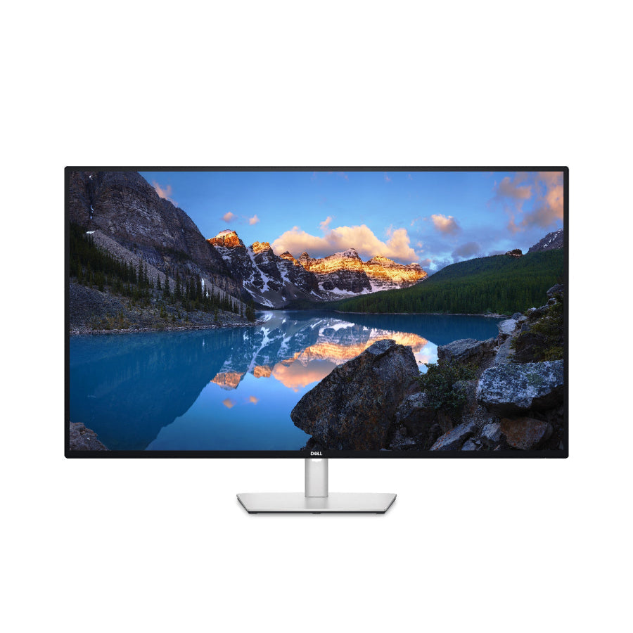 Monitor displaying a scenic mountain lake with a Dell logo