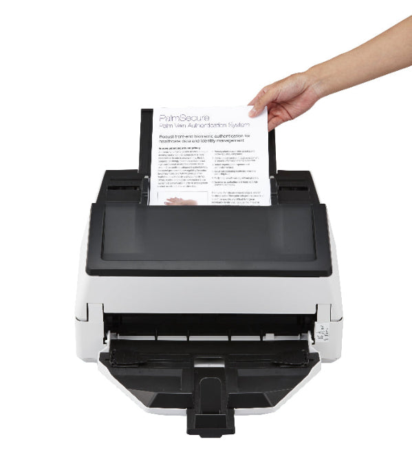Hand placing a document into a scanner on a white background