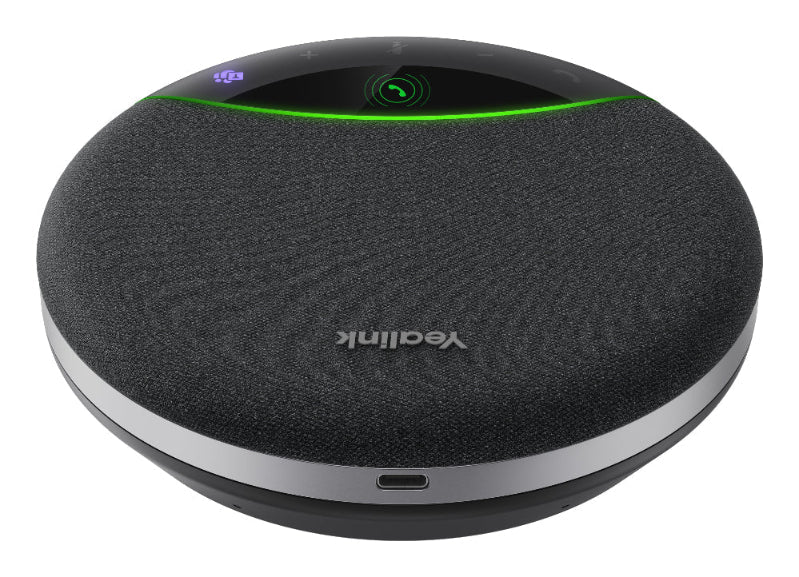 Round black device with green light and visible brand logo on a white background