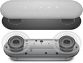 Top and bottom views of a gray and black portable speaker on a white background