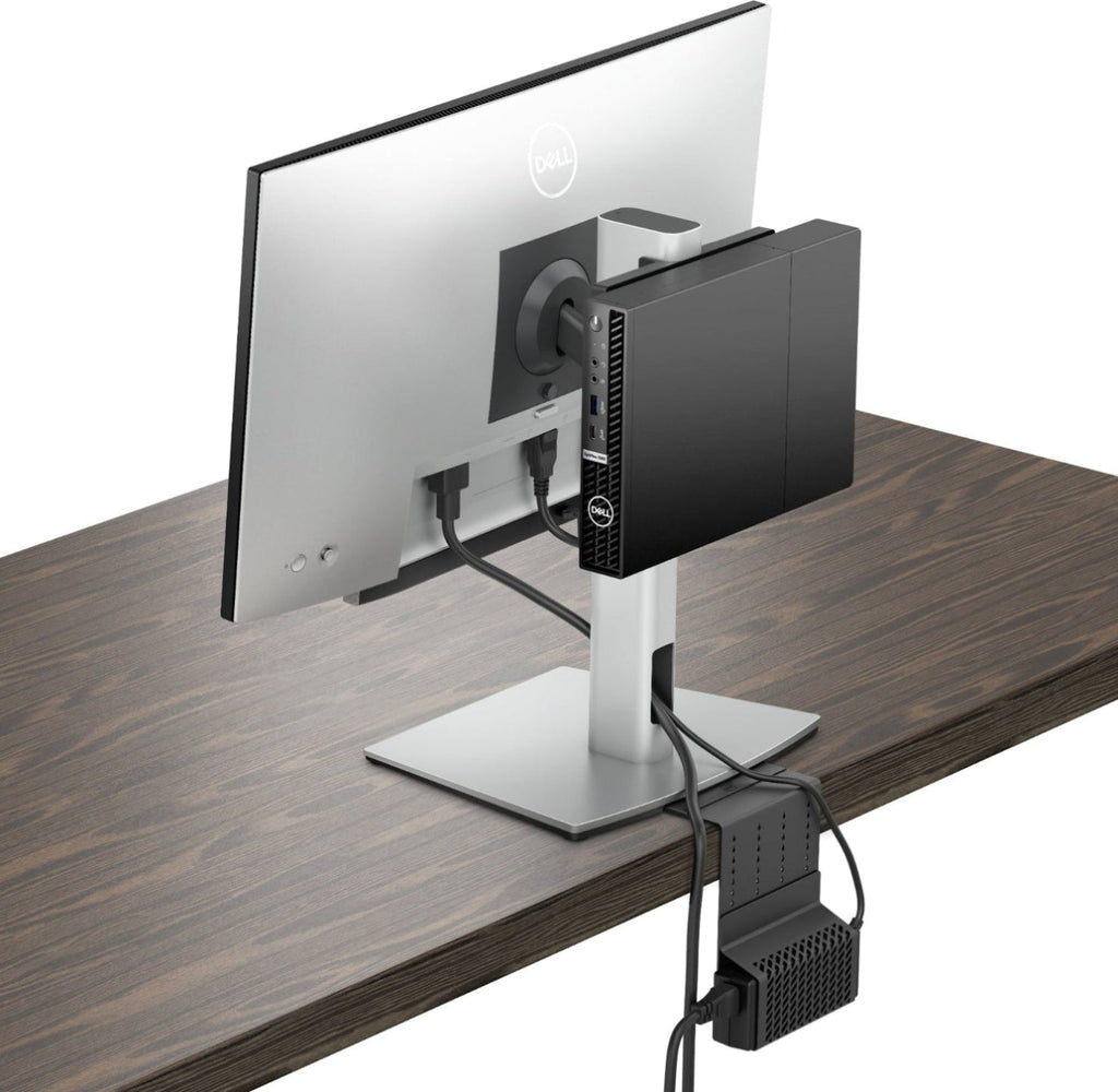 Computer monitor and external hard drive on a wooden desk with a white background